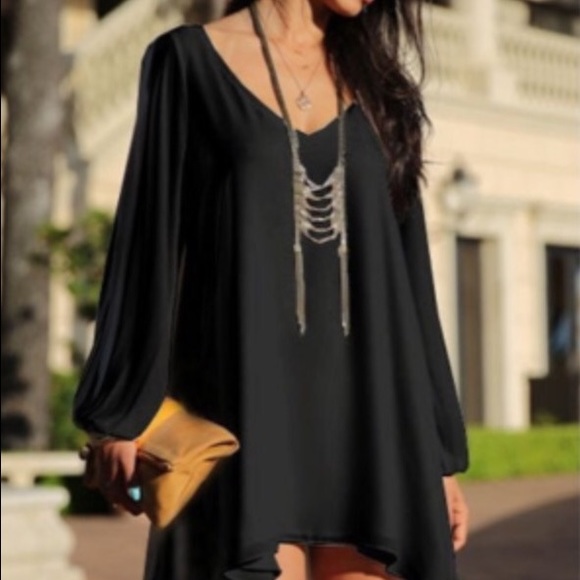 Short, chiffon dress with slit sleeves.