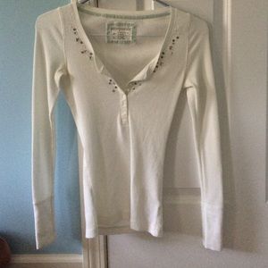 white stretch long sleeve shirt w/ embellishments