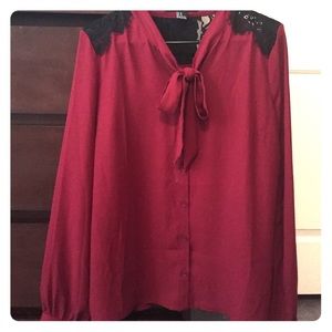 Maroon long sleeve top with black lace.