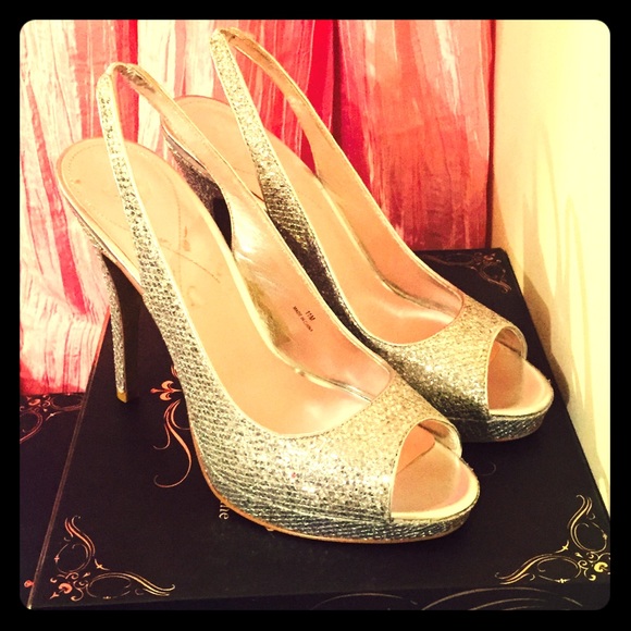 Great pair of never worn silver sling backs.