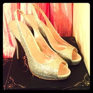 Great pair of never worn silver sling backs.