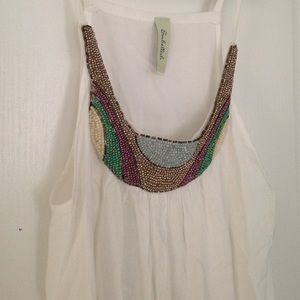 White flowy top with detailed neck