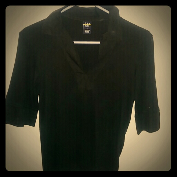 Black polo going to the elbows