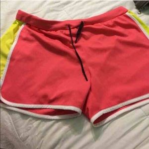 Pink and yellow reebok shorts