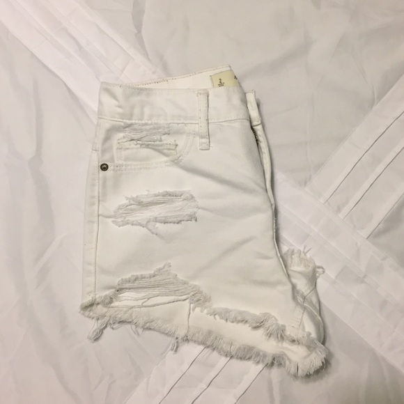 Distressed white denim shorts