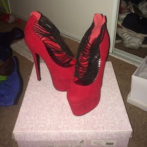 Black and red strappy heels with zipper