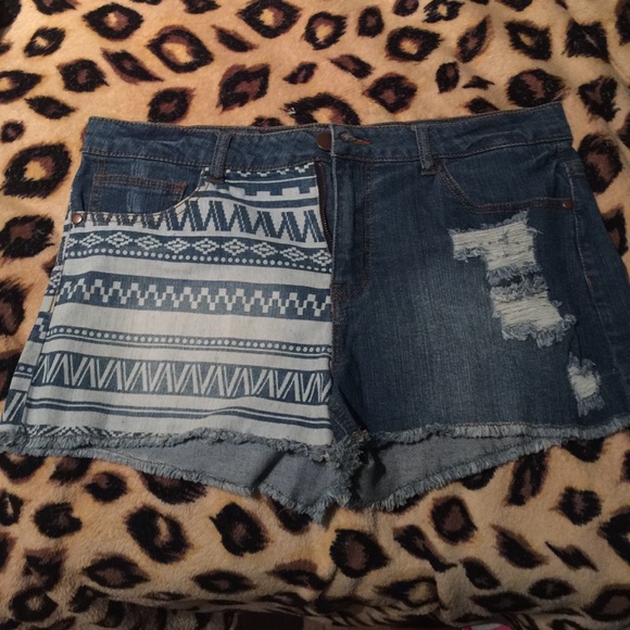 NEVER WORN Jean shorts. Half tribal/ ripped