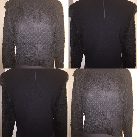 Black flower bomb crop top sweater.