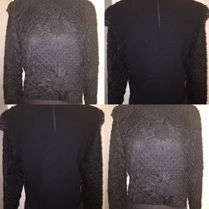 Black flower bomb crop top sweater.