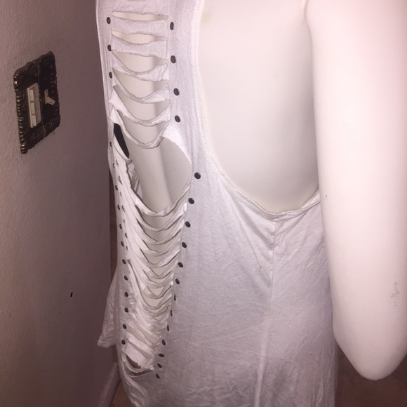 White shirt, light hood, cut outs, some studs...