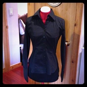 Black long-sleeve cotton blouse.