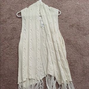 White sweater vest with fringe bottom