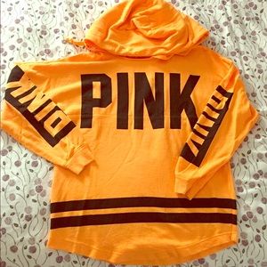 Orange varsity crew with hood