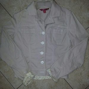 Khaki material button up jacket.