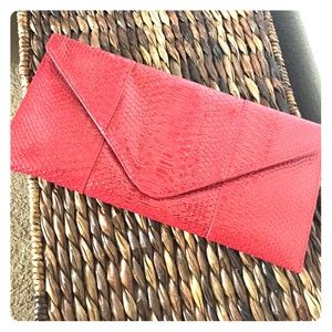 Red faux snakeskin clutch