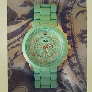 Mint green and gold Buckle watch.