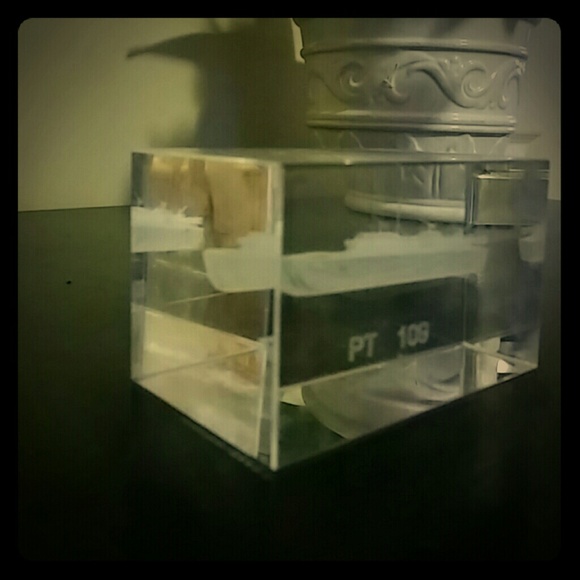 Glass block with a "PT 109" sculpture inside