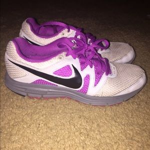 Purple Nike running shoes