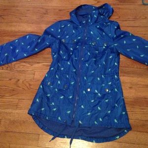 Blue rain coat with birds on it