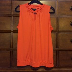 Sleeveless orange jersey top