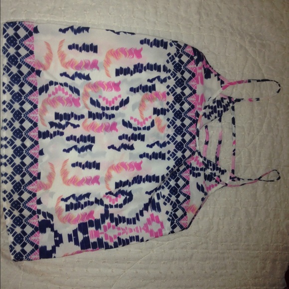 White with pink and blue tanks type of shirt