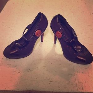 Brown t-strap heels.