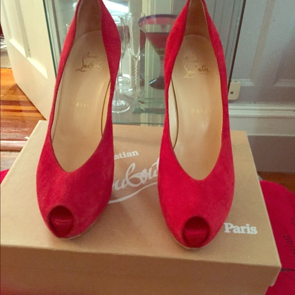 Red suede Christian Louboutin pumps