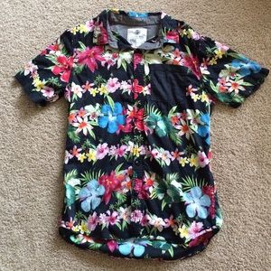 On the Byas Hawaiian print button up.