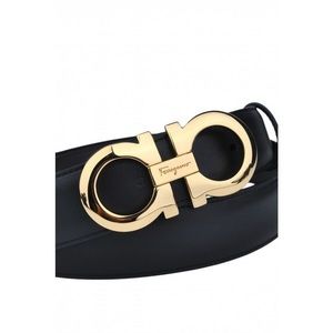 Brand new gold colored ferragamo belt buckle .