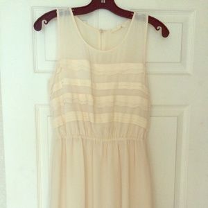 Cream mid length dress.