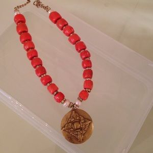 Orange glass beaded necklace with crystal accents.