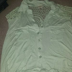 Super cute top with some lace and is mint green