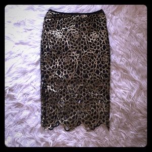 Metallic gold overlay on black fabric Mid length