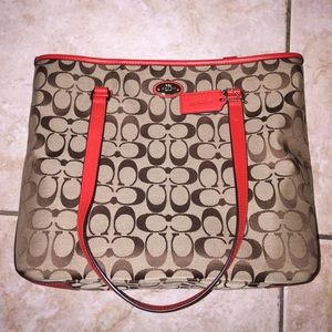 A red trim coach bag