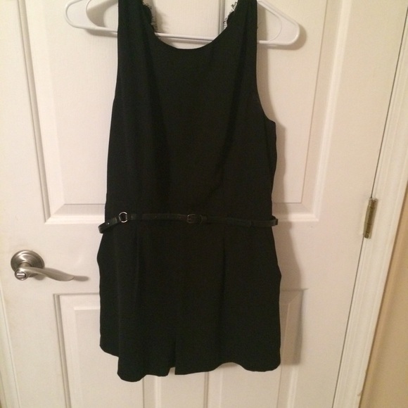 Black romper with lace back detail and belt. - Picture 1 of 3
