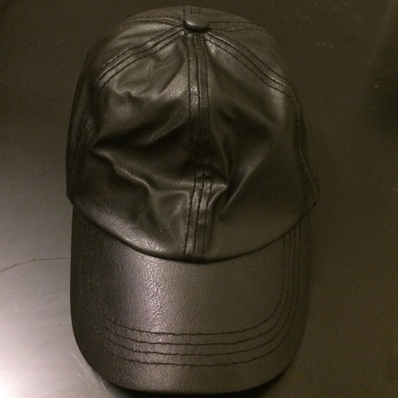 Black faux leather baseball cap. Adjustable strap