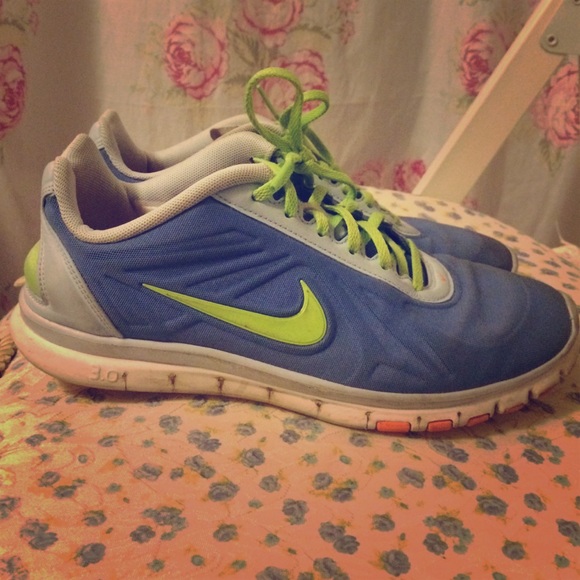 Blue and neon green Nike free runs 3.0