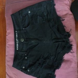 Black distressed short shorts