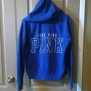 Pink zip up hoodie.