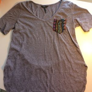 Nollie grey shirt with a pocket tee