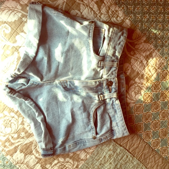 Light washed high-waisted shorts.