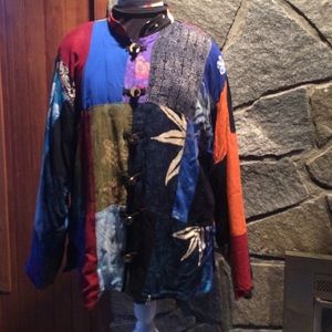 Mandarin collar, brass tie button jacket.