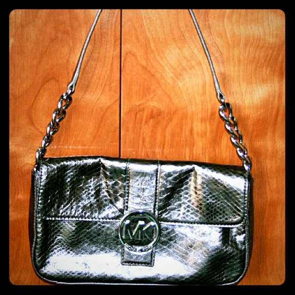 Michael Kors Handbags - MK silver clutch