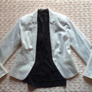Polka dot blouse with tie neck and smocked waist