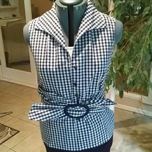 Sleeveless black and white checked shirt.