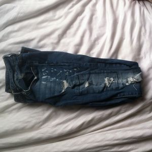Never worn distressed denim jeans