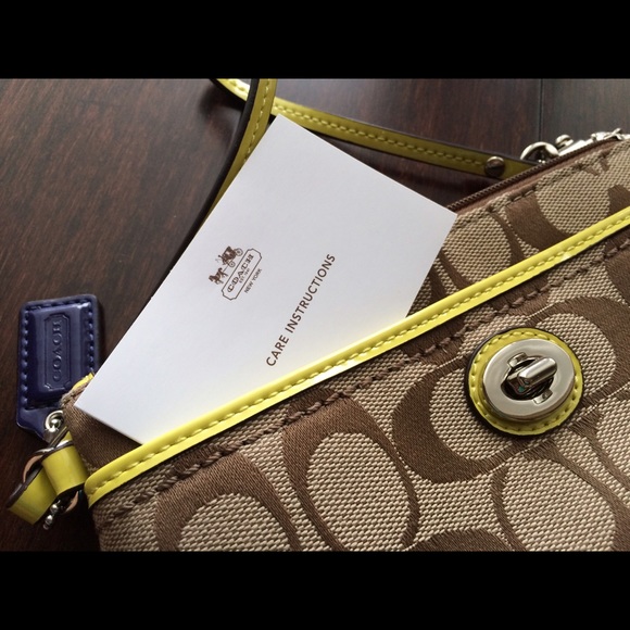 Brown coach wristlet with lime detail *NWOT*