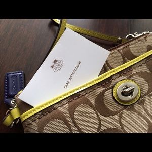 Brown coach wristlet with lime detail *NWOT*