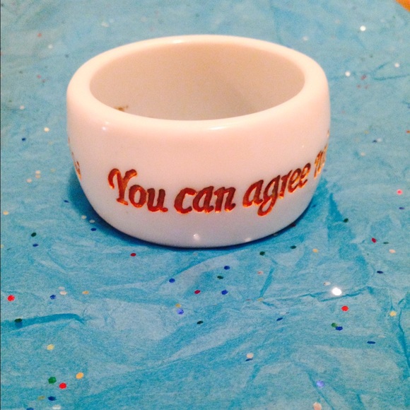 White bangle bracelet with gold carved writing