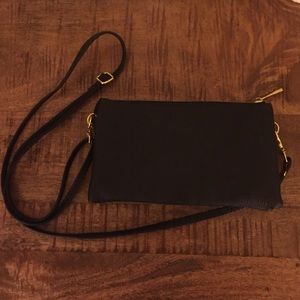 Black faux leather purse with adjustable strap!